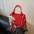 Vibrant red bucket bag with lychee texture, lace pearl charm and silver accents - Bow Charm Style / Burgundy
