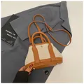 Beige woven canvas tote bag with brown leather trim and adjustable crossbody strap - Brown (Small Without Charm)