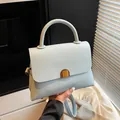 Light blue lychee pattern leather handbag with wood grain buckle and adjustable strap - Blue
