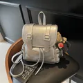 Metallic silver pleated backpack with buckles and a cute plush bear charm detail - With Pendant / 25*11*25cm / Silver