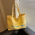 Large yellow canvas tote bag with Love you Baby print and blue typography details - Yellow / Large