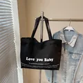 Large black canvas tote bag with Love You Baby print for casual stylish daily use - Black / Large