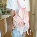 Pink canvas fashion backpack for women featuring flap closure and side pockets in daily use - 24*11*25 / Pink