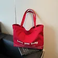 Large capacity red canvas tote bag with white inspirational text on casual shoulder bag - Red / Large
