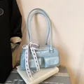 Lichtblauwe bowlingtas van kunstleer met twee voorzakken en een geruit kanten lintje - Blauw
