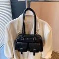 Black large capacity shoulder bag with dual front pockets and silver hardware detail - Black