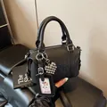 Black pebbled leather Boston bag with embossed letters and silver heart charm accessory - 19*9*11 / Black + Pendant