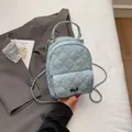 Mini blue denim backpack with diamond quilting and rhinestones featuring a chain strap - One Size / Blue