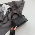 Black embossed leather Boston bag with chic letter details and adjustable shoulder strap - 19*9*11 / Black