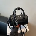 Minimalist black lychee pattern bowling bag with silver hardware and lock charm - Black With Rabbit Pendant