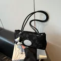 Chic black underarm bag with floral embroidery and metallic silver butterfly charm - With Pendant / Black With Bow Pendant