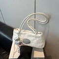 White underarm bag in 3D floral texture with silver bow pendant for summer fashion - With Pendant / White With Bow Pendant
