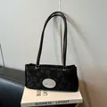 Black underarm bag with 3D floral embossed texture and silver metal nika logo plate - Without Pendant / Black without Pendant