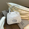 White textured floral crossbody bag with wide strap and silver plaque detail - 26x21x9cm / White