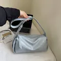 Light blue-grey soft faux leather shoulder pillow bag with wide strap and tassel zipper - Blue