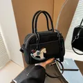 Black vintage Boston bag with a wooden horse charm and adjustable strap for women - Black + Pendant