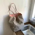 Canvas tote bag with coffee check pattern and pink lining shown in lifestyle setting - Pink (Double Sided Use)