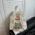 Striped canvas backpack featuring cute bunny ear straps and plush star accents - Khaki Striped