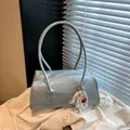 Light blue faux leather shoulder bag with cherry lace charm and minimalist rectangular shape - With Pendant / Blue