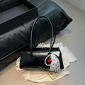 Glossy black handbag with cherry charm, pearl chain, and lace bow detail for women - With Pendant / Black