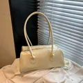 Minimalist creamy white leather baguette handbag with silver zipper and long shoulder strap - No Pendant / Yellow