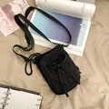 Sac bandoulière noir polyvalent pour femme avec nœud et texture en nylon souple - Noir