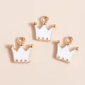 Three gold-plated crown charms with white enamel for DIY jewelry and necklaces - White