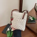 Cream crochet woven crossbody bag with strawberry charms and brown shoulder strap - Off White With Strawberry Charm