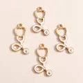 Set of four gold and white enamel stethoscope charms for DIY jewelry making - Stethoscope