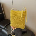 Yellow hand-woven crossbody bucket bag with floral crochet pattern and leather strap - Yellow