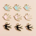 Macro shot of 9 colorful enamel swallow bird charms with gold plating for jewelry DIY - Multicolor