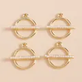 Detailed macro view of four minimalist gold geometric round pendants with white pearls - Gold