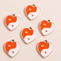 Set of heart-shaped pendants featuring orange and white Yin Yang Tai Chi enamel designs - Red Heart Tai Chi