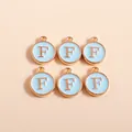 Macro view of blue enamel gold-tone letter F charms for jewelry making and DIY crafts - Letter F