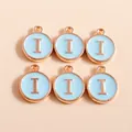 Macro detail of light blue enamel round charms with rose gold letter I for DIY jewelry - Letter I