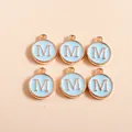 Detailed view of six light blue enamel round M-letter charms with gold plating for DIY crafts - Letter M