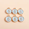 Close-up of six light blue enamel round charms with golden letter S for DIY jewelry making - Letter S
