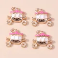 Detailed close-up of four pink and gold enamel pumpkin carriage charms for DIY jewelry - Rose Red