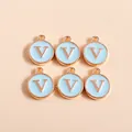 Macro shot of 6 light blue enamel and rose gold initial V charm pendants for DIY jewelry - Letter V