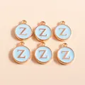 Macro detail of blue enamel letter Z charms with golden metal edges for DIY jewelry - Letter Z