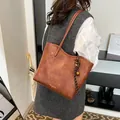 Brown vintage faux leather tote bag with FASHION & BAGS logo and decorative charm - With Charm / 26*10*24 / Brown