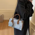 Contrast denim blue and brown leather tote bag with round coin purse and gold hardware - 25x10x15 / Blue
