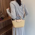 French retro dumpling bag in apricot woven texture with adjustable shoulder strap - Khaki