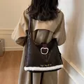 Retro dark brown tote bag with plush bear patch and furry trim shown on shoulder - Large / Brown