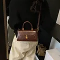 Vintage dark brown textured leather crossbody handbag with top handle and metal buckle - Brown