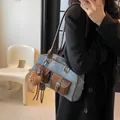 Retro denim Boston bag with leather trim and plush bear charm in mirror selfie - Denim Blue With Charm