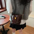 Dark brown leather bucket bag with gold buckle and slim crossbody strap for office style - 21*10*18 / Brown