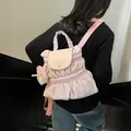 Sac à dos rose plissé pour femme avec texture volantée et pochette ronde suspendue - Rose