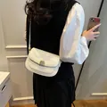 White faux crocodile saddle bag with gold metal lock and shoulder strap for women - No Pendant / 20x6x14cm / White