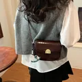 Dark reddish brown crocodile embossed crossbody saddle bag with golden metal hardware - With Charm / 20x6x14cm / Brown